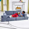 Boy reclined on Lazy Lounger configuration of the Yourigami Kids Play Gym in blue-lagoon color