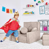 Boy dressed as a king playing by the Royal Throne configuration of the Yourigami Kids Play Fort in beige-sands color