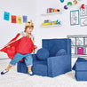 Boy dressed as a king playing by the Royal Throne configuration of the Yourigami Kids Play Fort in sapphire-caves color